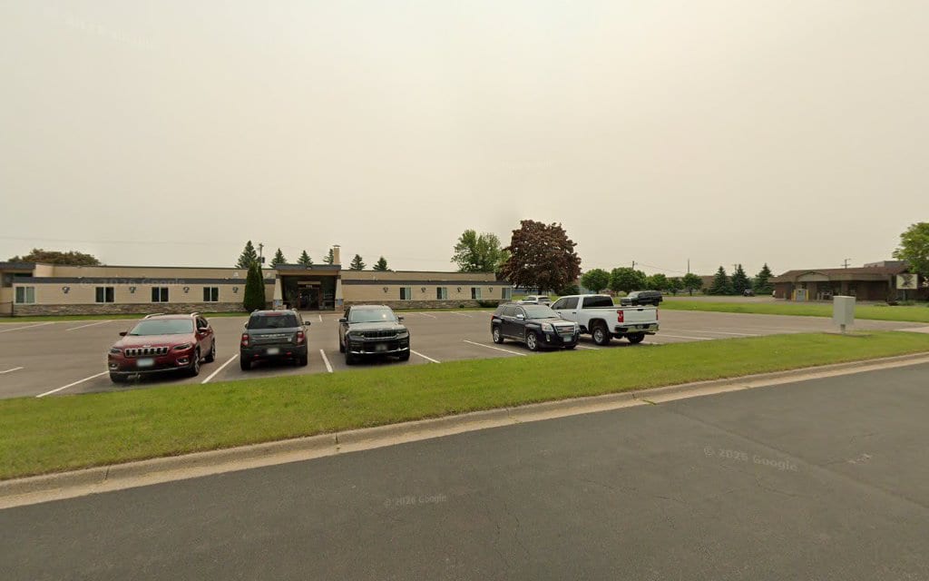 Single-story dental office building with parking lot in Hastings Minnesota
